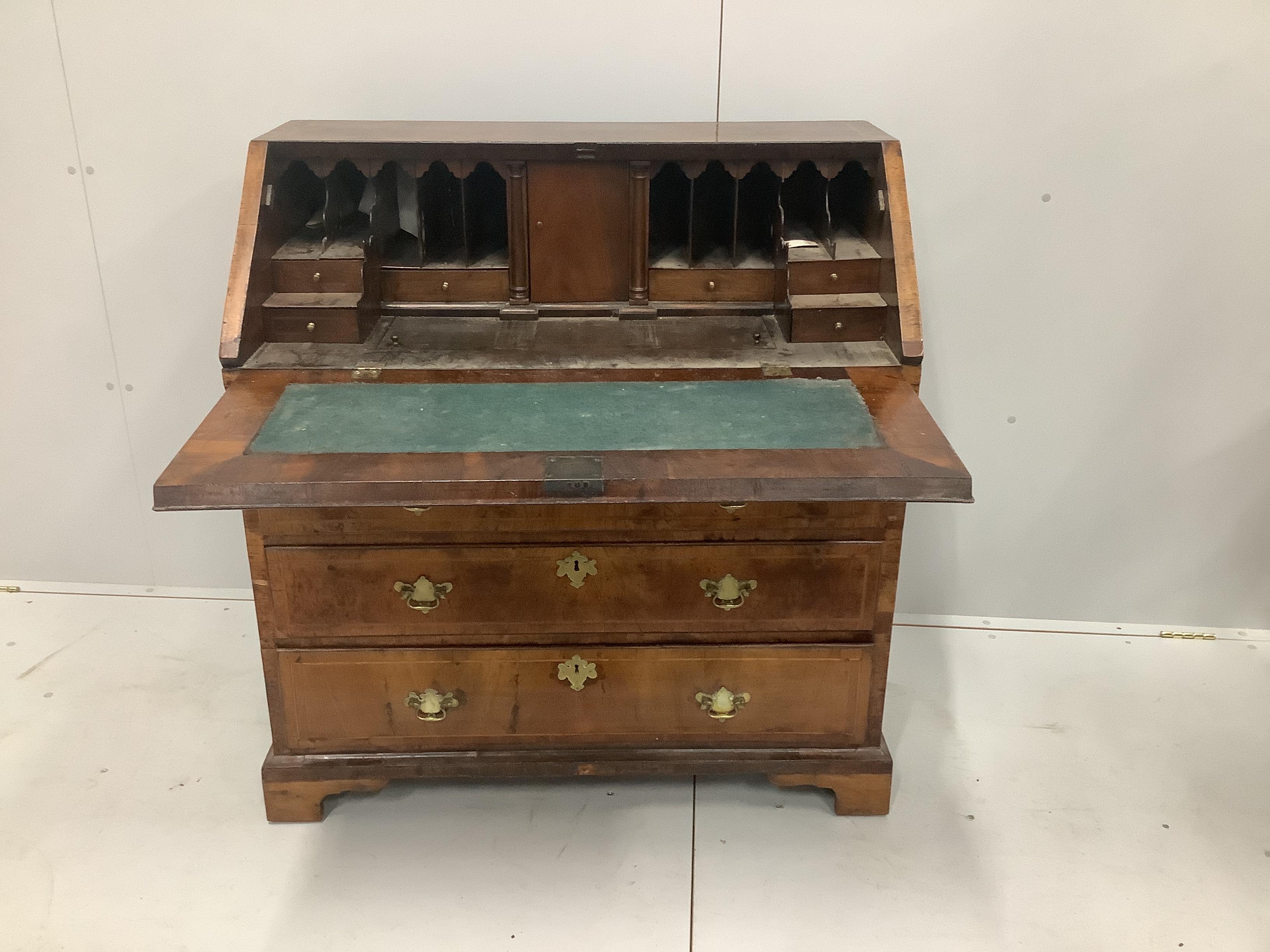 A mid 18th century walnut feather banded mahogany bureau, width 99cm